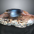 Natural Scenic View With Textured Rock And Metallic Bowl On Dark Background