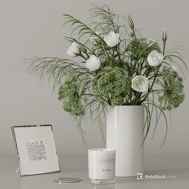 White Vase With White Flowers And Green Foliage Near Photo Frame And Candle 3d model 