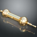 Golden Animal Sculpture With Spherical Ends And Cylindrical Body On Black Background