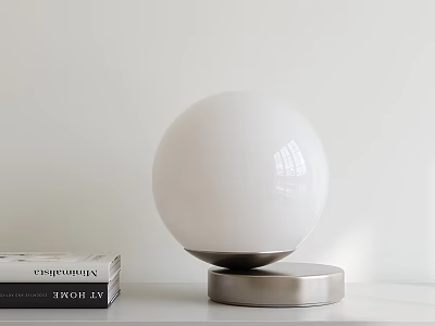 Modern White Globe Table Lamp With Silver Base On White Tabletop And Books 3d model