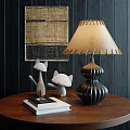 Elegant Table Lamp On Wooden Table With Cat Figurines Books And Dark Wooden Wall Art