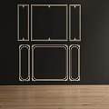 Black Background Wall With Gold Decorative Frames Various Shapes And Wooden Floor