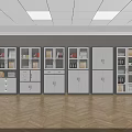 Row Of Modern White Bookcases With Glass Doors And Wooden Shelves On Herringbone Floor