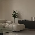 Minimalist Living And Dining Room With Dark Dining Table Rattan Chairs And Soft Natural Daylight