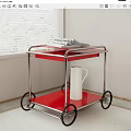 Red Two Tier Serving Cart With Metal Frame Black Wheels Newspaper And White Jug
