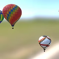 Colorful Hot Air Balloons As Amusement Rides Flying In Clear Blue Sky