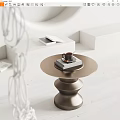 Modern Round Metallic Coffee Table With Coffee Cup Book And Geometric Decor In Minimalist Space