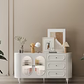 Elegant White Sideboard With Drawers Glass Doors Decorative Items And Green Plants On Beige Wall