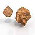 Two Natural Rough Brown Wooden Stone Pieces Displayed on White Background