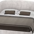 Modern Double Bed Design With Curved Upholstered Headboard Plaid Pillows And Tasseled Blanket