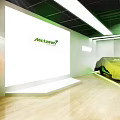 Futuristic Interior Space With Green Lighting Geometric Patterns And White Furniture