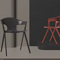 Modern Designer Dining Chairs In Black And Orange With Crossed Legs