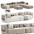 Modern Minimalist Sectional Sofa In Neutral Tones With Decorative Pillows Throw Blankets And Ottomans
