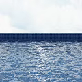 Serene Swimming Pool With Blue Tile Edge And Calm Water Surface Under Cloudy Sky View