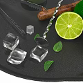 Fresh Lime Mint Drink With Ice Cubes And Bar Tools On Black Tray