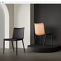 Stylish Modern Dining Chairs Black And Orange In Minimalist Interior Setting