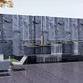 Garden Courtyard With Stone Wall Waterfall Sculpture And Outdoor Chairs
