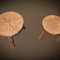 Two Rustic Wooden Stools With Round Seat Natural Wood Grain And Three Legs