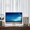 Apple iMac Desktop Computer Setup with Headphones Books External Devices on Wooden Desk