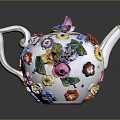 Decorative Porcelain Teapot With Colorful Flowers Vibrant Petals And Green Leaves