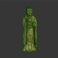 Golden Standing Buddha Statue With Robed Figure And Raised Hand Gesture In Traditional Decorative Design