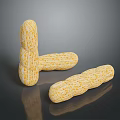 Three Roasted Peanuts With Crunchy Texture And Golden Color On Dark Surface