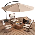 Wooden Frame Outdoor Chairs With Cushions And Wicker Coffee Table On Wooden Deck Under Umbrella
