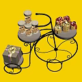 Decorative Ornament Set Featuring Black Iron Multi Tiered Trolley Gold Lidded Jars Ribbon Gift Boxes