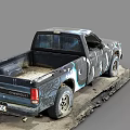 Old Worn Out Truck With Graffiti Paint And Worn Tires Parked On Dirty Ground