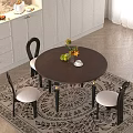 Elegant Round Brown Dining Table And Black Chairs With Golden Leg Accents Sunflowers White Cabinets
