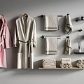 Modern Bathroom With Hanging Bath Towels Robes And Rolled Towels On Shelves