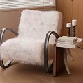 Plush White Fur Leisure Chair with Black Metal Curved Arms and Wooden Side Table Candles and Books