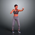 Woman Practicing Boxing Stance In Gray Sports Bra And Leggings