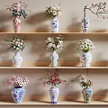 Blue And White Ceramic Vases With Floral Arrangements On Wooden Shelves