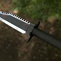 Tactical Survival Knife With Serrated Blade Black Textured Handle And Metal Pommel