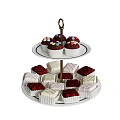 Two Tier Dessert Stand With Colorful Sprinkled Cupcakes And Square Pastries On White Plates