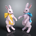 White Bunny Stuffed Toys With Yellow And Blue Bows Standing On Dark Surface