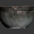 Ancient Bronze Vessel With Ornate Dragon Head Handles And Intricate Carved Patterns