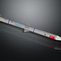 ORTUS Missile Design Featuring Blue Stripes And Red Emblem On Gray Body