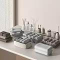 Soft Absorbent Towels in Neutral Tones Displayed on Table with Storage Containers and Bathroom Accessories