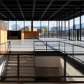 Modern Exhibition Hall Interior Design With Grid Ceiling Glass Windows Wooden Walls And Staircase
