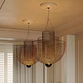 Two Woven Metal Cylindrical Bowl Chandeliers Ceiling Mounted In Indoor Dining Room
