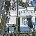 Aerial View of Industrial Plant with Multiple Buildings Blue Roofs Roads and Green Belts