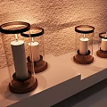 Decorative Ornament Set with Glass Covered Candle Holders Wooden Bases on Light Colored Shelf