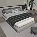 Modern Double Bed With White Headboard Grey White Pillows Wooden Floor And Rug Plant