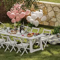 Charming Garden Patio With Pink White Balloons White Folding Chairs Stone Wall And Picnic Mat