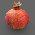 Fresh Ripe Pomegranate with Red Pink Speckled Skin and Crown on Gray Background