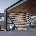 Modern Sales Office Building With Unique Curved Design And Wooden Roof Structure