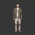 Man in brown shirt white undershirt khaki pants beige shoes against gray black gradient background
