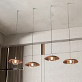 Four Modern Copper Pendant Lights Hanging From Ceiling In Minimalist Interior